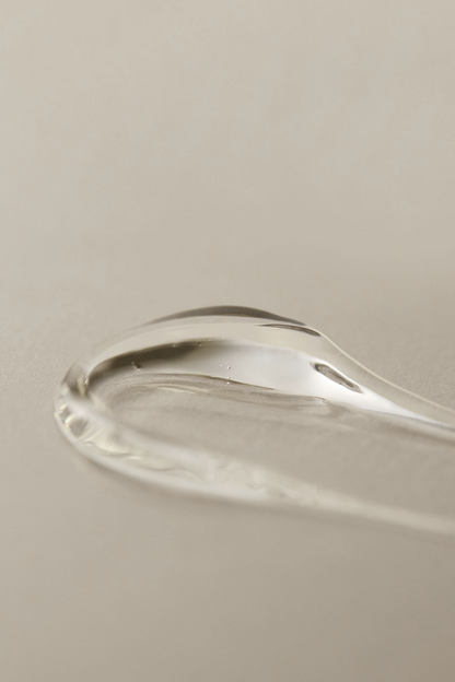 Texture shot of Aromatica's Organic Aloe Vera Gel against a soft light grey background.