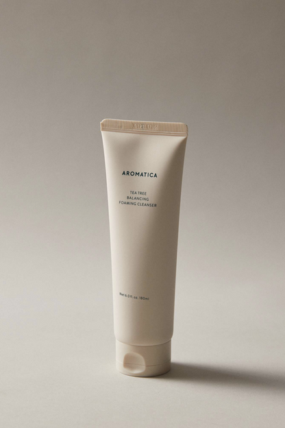 Aromatica's Tea Tree Balancing Foaming Cleanser bottle against a light grey background.