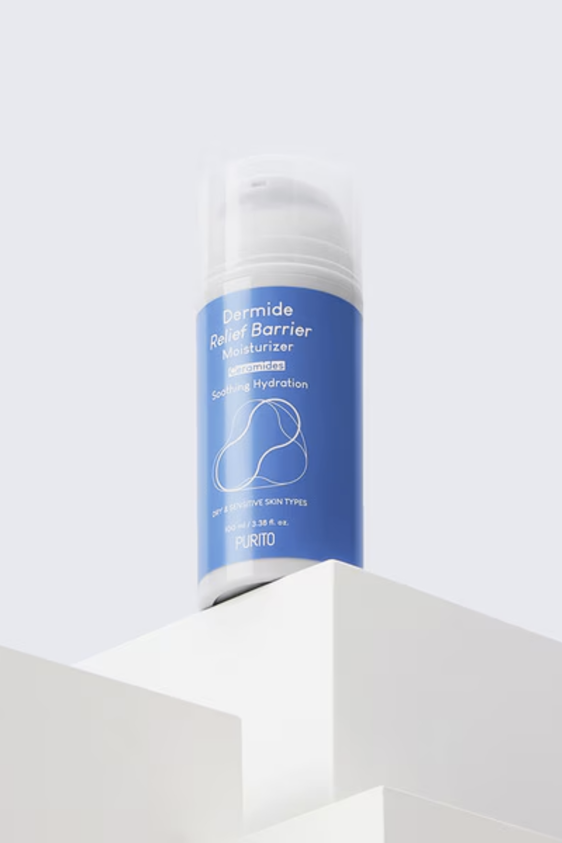 Bottle of Purito's Dermide Relief Barrier Moisturizer standing on a white platform against a white background. Available for purchase at Sinless Skincare.