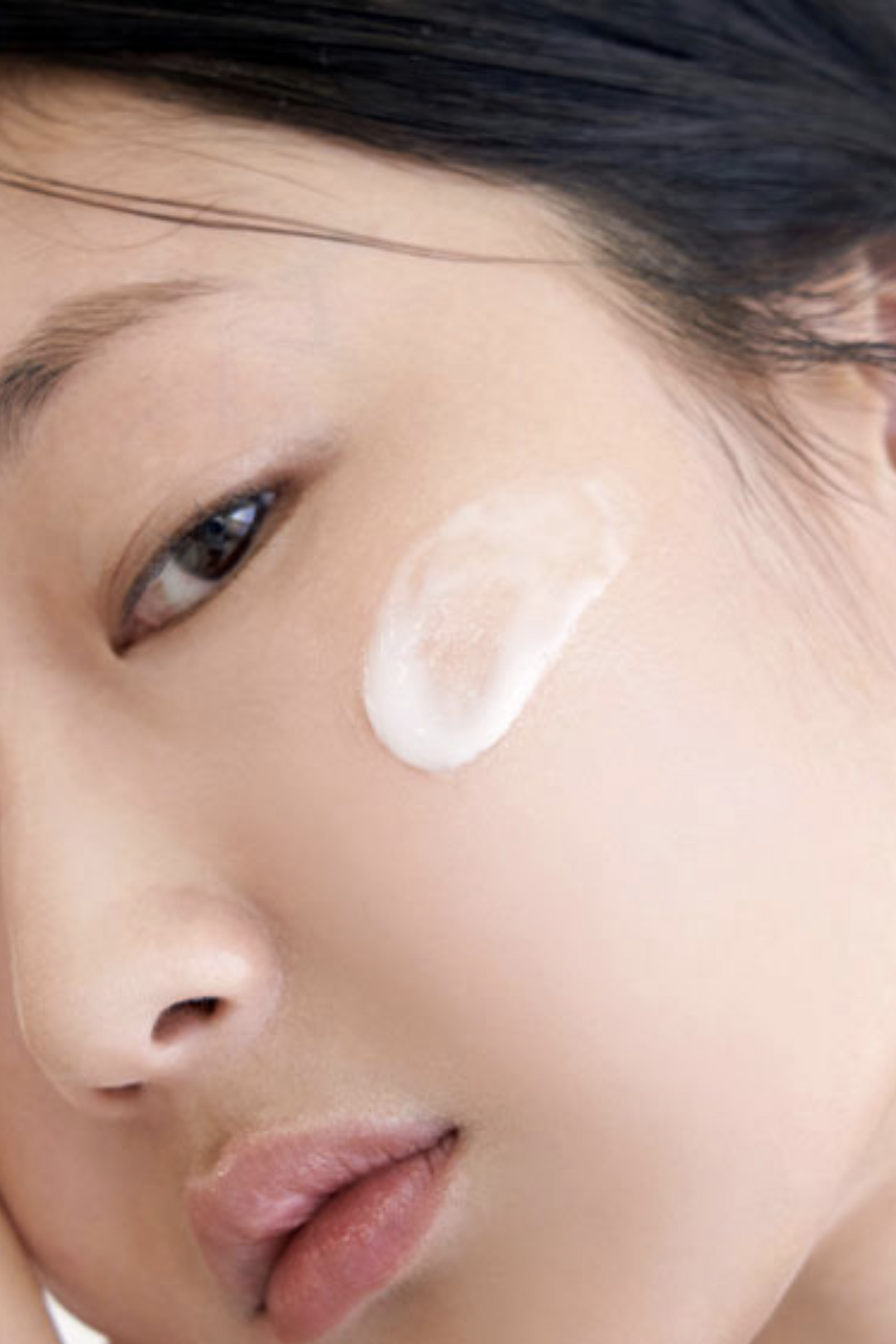 Close up of woman's cheek with a smear of Klairs' Freshly Juiced Vitamin E Mask.