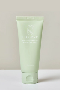 Tube of Licorne's Vegan Matcha Wash-Off Pack on a white surface against a light grey background. Available for purchase at Sinless Skincare.